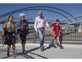 Michael Thompson, City of Calgary director of transportation, walks with pedestrians and bikers on the new Shaganappi pedestrian overpass.