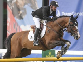 Eric Lamaze vies for the $34,000 Bantrel Cup in the International Ring at Spruce Meadows in Calgary on Wednesday, June 3, 2015.