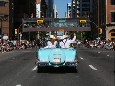 William Shatner, right, as the 2014 Stampede Parade Grand Marshal, with his wife Elizabeth, during the parade in Calgary, on July 4, 2014.