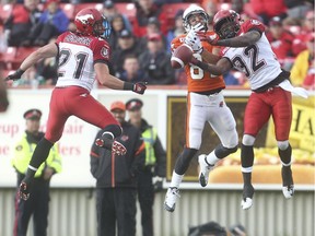 Calgary Stampeder defensive back Tevaughn Campbell jumps to intercept a B.C. Lions pass at McMahon Stadium in Calgary on Friday, June 12, 2015.