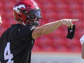Drew Tate points out a play at the last practice before Calgary Stampeders first preseason game at McMahon Stadium in Calgary, on June 11, 2015.