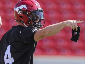 Drew Tate points out a play at the last practice before the Calgary Stampeders play their preseason opener against B.C. on Friday.