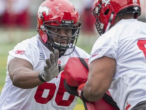 Offensive lineman Christian Johnson practises blocking during the Calgary Stampeders training camp at McMahon Stadium on Tuesday.