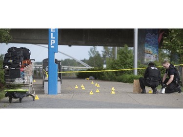Calgary Police investigate a suspicious death along Riverbank Avenue in Calgary on Thursday, June 4, 2015.