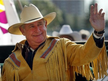 Then Premier Ralph Klein, 2005 co-parade marshall, along with Norm Kwong,  with the theme, "Celebrating Alberta's Centennial."