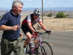 Adventure cyclist Ryan Correy with his father helping out alongside.