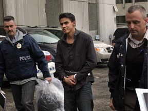 Sheldon Bertrum Worme arrested for first-degree murder is escorted by CPS investigators to Arrest Processing Unit in downtown Calgary Friday, Feb. 6, 2009.