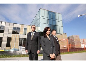 Bernelle Construction Management president Chris Goulard, right, with Robert Majamaa, senior project manager, and Diana Gonzalez, project manager, outside the new Taylor Institute for Teaching at the University of Calgary on June 4, 2015.