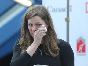 Christine Nesbitt dabs away a tear as she announces her retirement at the Olympic Oval in Calgary in Thursday.