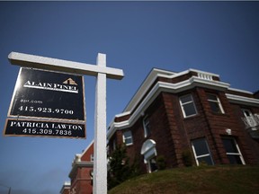 A sign is posted in front of a home for sale on July 2, 2013 in San Francisco, California.