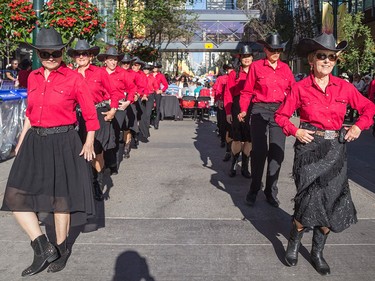 The Chinook County Line Dancers perform in front of a hungry downtown crowd at Calgary Economic Development's sixth annual First Flip on Stephen Avenue in Calgary on Thursday.