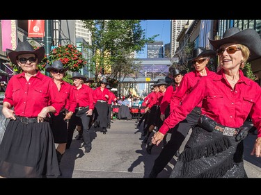The Chinook County Line Dancers perform in front of a hungry downtown crowd at Calgary Economic Development's sixth annual First Flip on Stephen Avenue in Calgary on Thursday.