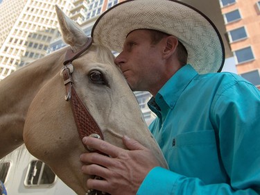 David Cowley prepares to lead his horse in an elevator to the observation deck of the Calgary Tower on Thursday.