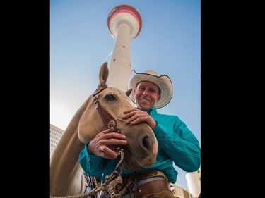 David Cowley prepares to lead his horse in an elevator to the observation deck of the Calgary Tower in Calgary on Thursday, July 2.