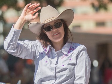 Kathleen Ganley waves to the crowds at the Calgary Stampede Parade in Calgary on Friday, July 3.