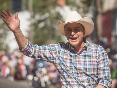 Joe Ceci waves to the crowds at the Calgary Stampede Parade in Calgary on Friday, July 3.