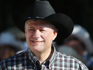 Prime Minister Stephen Harper enjoys the Calgary Stampede parade on July 3.