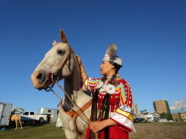 Indian Princess alumni, Amelia Crowshoe, gets ready to ride during the Stampede Parade.