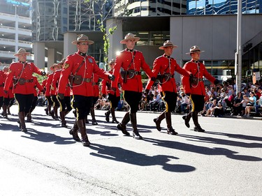Members of the Royal Canadian Mounted Police march during the Calgary Stampede parade on July 3.