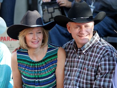 Prime Minister Stephen Harper enjoys the Calgary Stampede parade on July 3, 2015 with his wife Laureen.