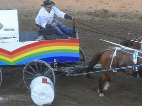 Rae Croteau Jr. doesn't look impressed as he knocks over a barrel right at the start of his heat, resulting in a five second penalty, nulling his winning run during heat five of day one at the 2015 Calgary Stampede GMC Rangeland Derby's Chuckwagon Racing in Calgary, on July 3, 2015.