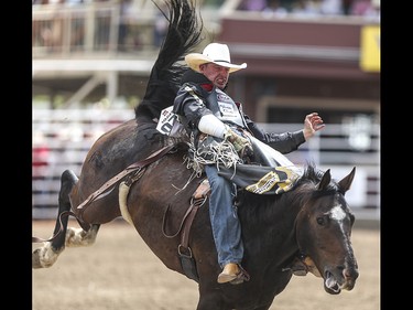 Jake Void is brought all around the ring during the bareback event at the Calgary Stampede Rodeo at the Stampede Grandstand in Calgary on Saturday, July 4, 2015.