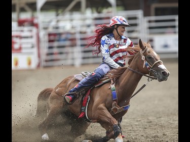 Fallon Taylor wears her forth of july outfit for the barrel racing event at the Calgary Stampede Rodeo at the Stampede Grandstand in Calgary on Saturday, July 4, 2015.
