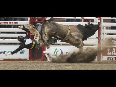 Tyler Pankewitz is thrown from his bull during the bull riding event at the Calgary Stampede Rodeo at the Stampede Grandstand in Calgary on Saturday, July 4, 2015.