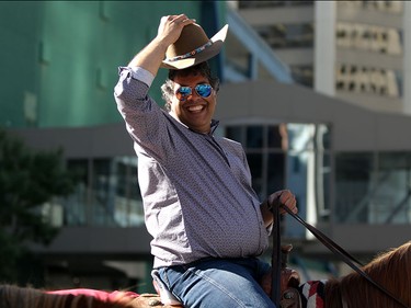 Mayor Naheed Nenshi salutes the crowds during the Calgary Stampede parade on July 3.