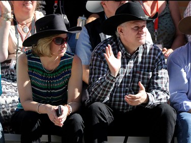 Prime Minister Stephen Harper and his wife Laureen enjoys the Calgary Stampede parade on July 3.