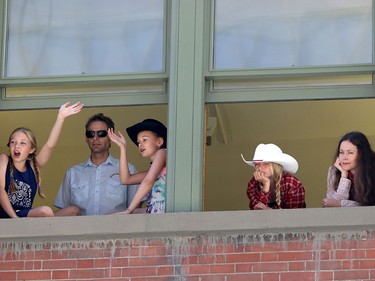 People take to buildings for a better view of the Calgary Stampede parade on July 3.