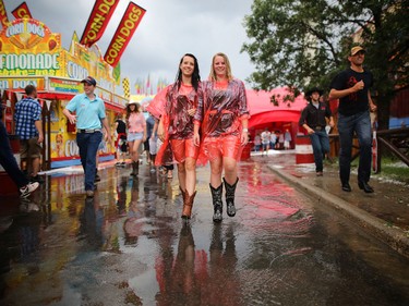 These ladies sported some new Stampede fashion when the rain and hail hit the Calgary Stampede grounds on July 4, 2015.