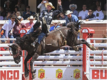 Dusty LaValley rides Rapper Margie for a sixth place finish during day three bareback action at the 2015 Calgary Stampede, on July 5, 2015.