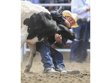K.C. Jones finishes in second place during day three steer wrestling action at the 2015 Calgary Stampede, on July 5, 2015.