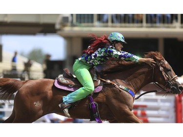 Fallon Taylor races to a second place finish during day three barrel racing action at the 2015 Calgary Stampede, on July 5, 2015. -