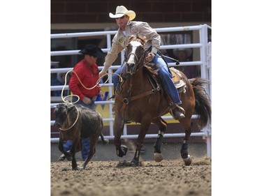 Ryan Jarrett ropes his way to a second place finish during day three tie-down roping action at the 2015 Calgary Stampede, on July 5, 2015.