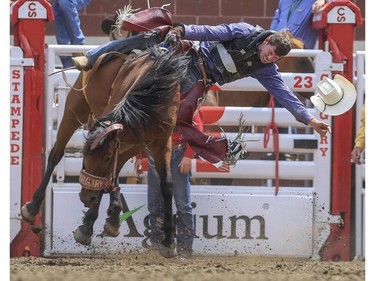 Allen Fletcher rides Yacht Hijacker to a second place finish during day three novice bareback rodeo action at the 2015 Calgary Stampede, on July 5, 2015.