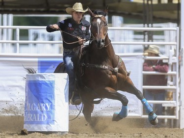 Mary Walked speeds around the Calgary Herald barrel during day three barrel racing action for a first place finish at the 2015 Calgary Stampede, on July 5, 2015. -