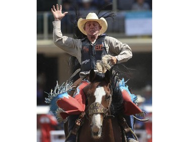 Cody Wright holds on for a second place finish during day three saddle bronc action at the 2015 Calgary Stampede, on July 5, 2015. -