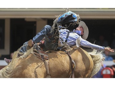 Matt Lait rides Gold Dust to a third place finish during day three bareback action at the 2015 Calgary Stampede, on July 5, 2015.