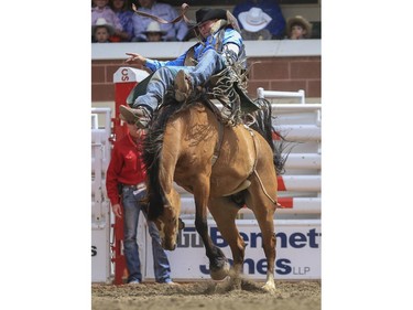 Kyle Bowers rides his way to a first place finish during day three bareback action at the 2015 Calgary Stampede, on July 5, 2015.