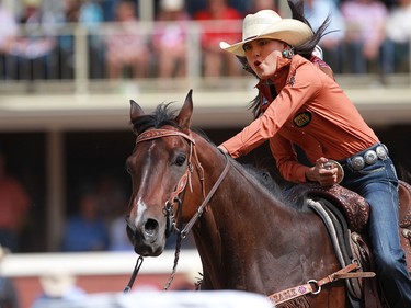 Kassidy Dennison of Tohatchi, NM earned first place in barrel racing with a time of  17.41 on day four of rodeo action at the Calgary Stampede on July 6, 2015.
