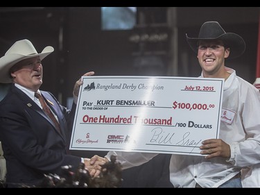 Kurt Bensmiller, right, winner of the 2015 Calgary Stampede GMC Rangeland Derby's Chuckwagon Racing at the Stampede Grandstand in Calgary on Sunday, July 12, 2015.