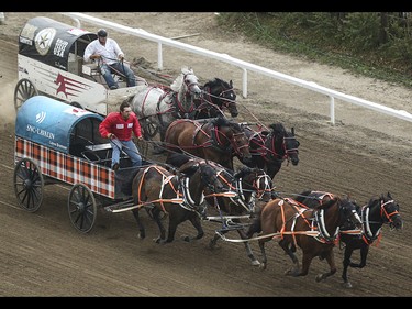 Layne Bremner, bottom, edges out Dave Galloway  during heat one, day nine, of the GMC GMC Rangeland Derby at the Calgary Stampede Grandstand in Calgary on Saturday, July 11, 2015.