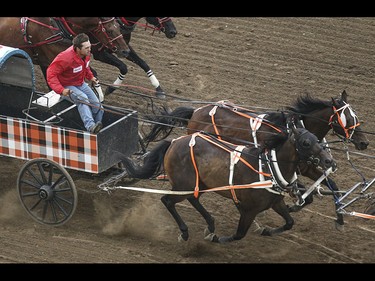 Layne Bremner takes heat one, day nine, of the GMC GMC Rangeland Derby at the Calgary Stampede Grandstand in Calgary on Saturday, July 11, 2015.