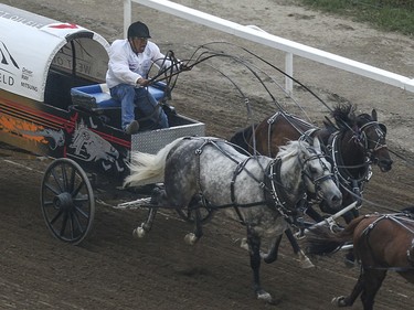 Ray Mitsuing leads heat three, day nine, of the GMC GMC Rangeland Derby at the Calgary Stampede Grandstand in Calgary on Saturday, July 11, 2015.
