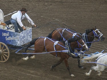 Mitch Sutherland races towards the finish in heat four, day nine, of the GMC GMC Rangeland Derby at the Calgary Stampede Grandstand in Calgary on Saturday, July 11, 2015.
