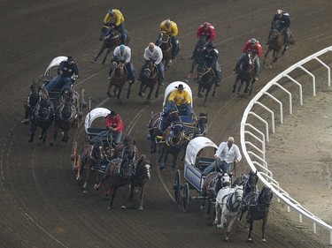Chuckwagon racing in heat five, day nine, of the GMC GMC Rangeland Derby at the Calgary Stampede Grandstand in Calgary on Saturday, July 11, 2015.