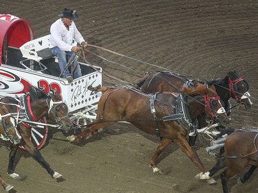 Chuckwagon racing in heat six, day nine, of the GMC GMC Rangeland Derby at the Calgary Stampede Grandstand in Calgary on Saturday, July 11, 2015.