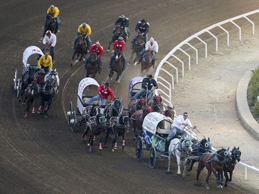 Chuckwagon racing in heat nine, day nine, of the GMC GMC Rangeland Derby at the Calgary Stampede Grandstand in Calgary on Saturday, July 11, 2015.